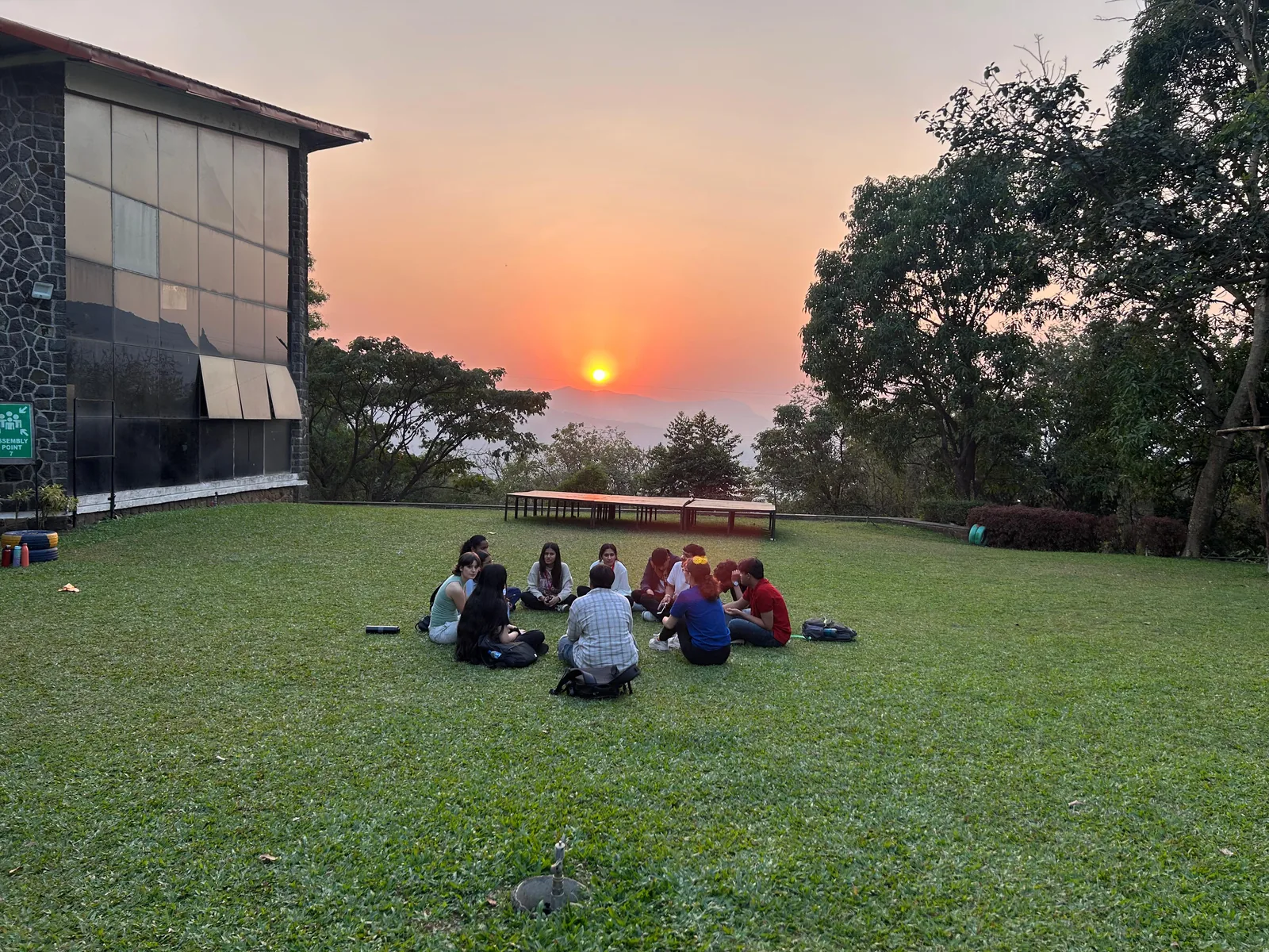 A large group of MUWCI students on the campus steps