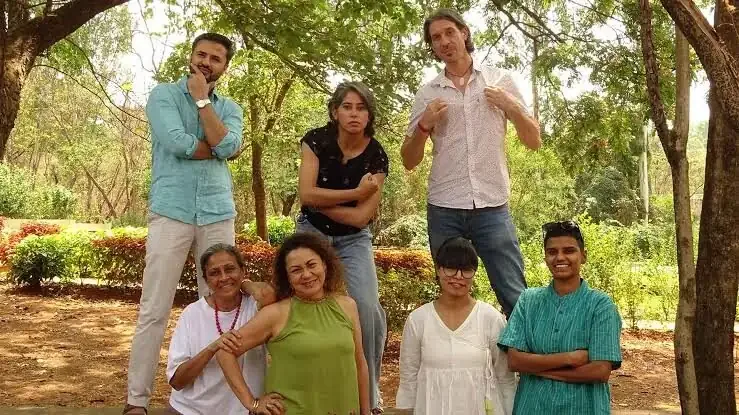 MUWCI counsellors and wellbeing staff standing together among the campus trees
